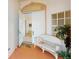 Front porch with a white wicker bench and a view of the interior at 10208 Arrowhead Dr, Punta Gorda, FL 33955