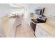 Bright kitchen with stainless steel appliances and ample cabinetry at 10208 Arrowhead Dr, Punta Gorda, FL 33955