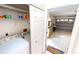 Convenient laundry room with washer, dryer, and garage access at 10208 Arrowhead Dr, Punta Gorda, FL 33955
