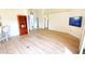 Open living room with laminate wood flooring at 10208 Arrowhead Dr, Punta Gorda, FL 33955