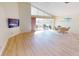 Spacious living room with laminate flooring and access to a patio at 10208 Arrowhead Dr, Punta Gorda, FL 33955