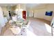 Spacious living room with wood-look floors and open concept at 10208 Arrowhead Dr, Punta Gorda, FL 33955