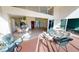 Relaxing patio with seating area overlooking the living and dining areas at 10208 Arrowhead Dr, Punta Gorda, FL 33955