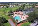 Community pool, tennis courts, and clubhouse at 10208 Arrowhead Dr, Punta Gorda, FL 33955