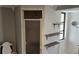 Bright bathroom showcases tiled shower, floating shelves, and modern fixtures, creating a clean and functional space at 1108 Ample Ave, Port Charlotte, FL 33948