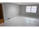 Neutral bedroom featuring freshly painted walls and a large window providing natural light at 1108 Ample Ave, Port Charlotte, FL 33948