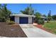 A well maintained home with a clean driveway and a one car garage door at 1108 Ample Ave, Port Charlotte, FL 33948