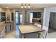 Well-lit kitchen featuring an island with a granite countertop and seating for three at 1108 Ample Ave, Port Charlotte, FL 33948