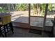 Enclosed patio with brick flooring and view of backyard at 1108 Ample Ave, Port Charlotte, FL 33948