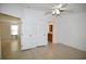 Primary bedroom with tile floors and access to bathroom at 12415 Catalina Dr, Punta Gorda, FL 33955