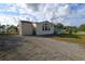 Single-wide manufactured home with shed and gravel driveway at 12415 Catalina Dr, Punta Gorda, FL 33955