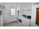 Laundry room with washer, dryer, and exterior access at 12415 Catalina Dr, Punta Gorda, FL 33955