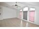 Living room with vaulted ceiling and large windows at 12415 Catalina Dr, Punta Gorda, FL 33955
