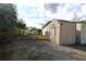 Tan colored storage shed in backyard at 12415 Catalina Dr, Punta Gorda, FL 33955