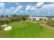 Golf course view with players and golf carts near villas at 14049 Black Beauty Dr # 712, Punta Gorda, FL 33955