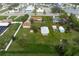 Aerial showing a single Gathering home with detached garage and shed, on a large lot at 1713 Belvidere Rd, Englewood, FL 34223
