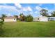 Large backyard with multiple storage buildings at 1713 Belvidere Rd, Englewood, FL 34223