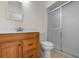 Bathroom with wood vanity, toilet, and a shower stall at 1713 Belvidere Rd, Englewood, FL 34223