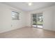 Bedroom with sliding glass doors to the patio at 1713 Belvidere Rd, Englewood, FL 34223