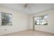 Spacious bedroom with tile floors and large windows at 1713 Belvidere Rd, Englewood, FL 34223