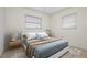 Bright bedroom with tiled floors and neutral walls at 1713 Belvidere Rd, Englewood, FL 34223