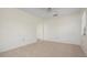 Simple bedroom with tile floors and an open doorway at 1713 Belvidere Rd, Englewood, FL 34223