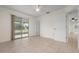 Bedroom with sliding glass doors leading to a screened porch at 1713 Belvidere Rd, Englewood, FL 34223