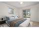 Bedroom with sliding glass doors to the patio at 1713 Belvidere Rd, Englewood, FL 34223