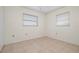 Empty bedroom with tile flooring and window coverings at 1713 Belvidere Rd, Englewood, FL 34223