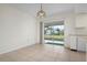 Bright dining area with access to back patio at 1713 Belvidere Rd, Englewood, FL 34223