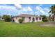 Single-story house with a side view showcasing its facade at 1713 Belvidere Rd, Englewood, FL 34223