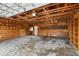 Unfinished garage with shelving and a workbench at 1713 Belvidere Rd, Englewood, FL 34223