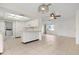 Kitchen with white cabinets, stove and microwave at 1713 Belvidere Rd, Englewood, FL 34223