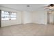 Living room with tiled floors and neutral walls at 1713 Belvidere Rd, Englewood, FL 34223