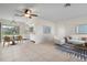 Open living and dining area with tile flooring and kitchen access at 1713 Belvidere Rd, Englewood, FL 34223