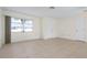 Living room featuring tile floors and multiple windows at 1713 Belvidere Rd, Englewood, FL 34223