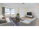 Living room with tiled floors and modern furniture at 1713 Belvidere Rd, Englewood, FL 34223