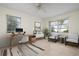 Home office featuring a desk, chairs, and window views at 1713 Belvidere Rd, Englewood, FL 34223