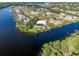Waterfront property showcasing a home with a pool and private dock at 18138 Petoskey Cir, Port Charlotte, FL 33948