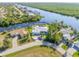 Stunning aerial view showcasing waterfront property and canal access at 18138 Petoskey Cir, Port Charlotte, FL 33948