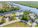 Aerial view of waterfront home with private dock and canal access at 18138 Petoskey Cir, Port Charlotte, FL 33948