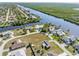 Aerial view of vacant lot near canal and homes at 18138 Petoskey Cir, Port Charlotte, FL 33948