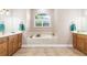 Bathroom features a large soaking tub, double vanity at 18138 Petoskey Cir, Port Charlotte, FL 33948