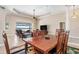 Bright dining room with access to the living room and water view at 18138 Petoskey Cir, Port Charlotte, FL 33948