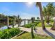 Private dock and well maintained yard with tropical landscaping at 18138 Petoskey Cir, Port Charlotte, FL 33948