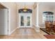Bright and spacious entryway with tile flooring and double doors at 18138 Petoskey Cir, Port Charlotte, FL 33948
