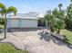 Charming waterfront home with two-car garage and landscaped yard at 18138 Petoskey Cir, Port Charlotte, FL 33948