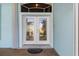 Elegant double front doors with etched glass details at 18138 Petoskey Cir, Port Charlotte, FL 33948