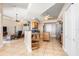 Open kitchen features island and breakfast bar, flows into living area at 18138 Petoskey Cir, Port Charlotte, FL 33948