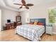 Main bedroom with large bed, built-in shelving and pool view at 18138 Petoskey Cir, Port Charlotte, FL 33948